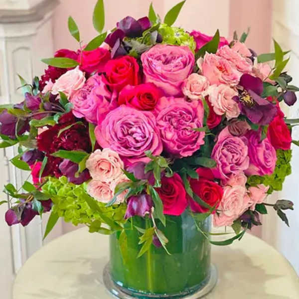 Pink and red rose bouquet in a glass vase