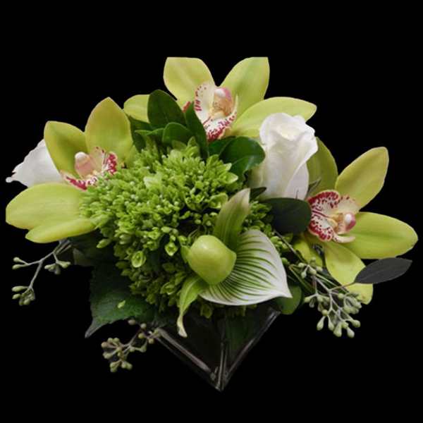 Green and white bouquet with orchids and calla lily in a clear wrap