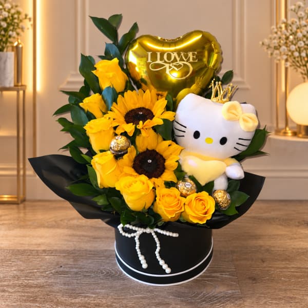 Yellow roses and sunflowers with a Hello Kitty plush and heart balloon in a black box