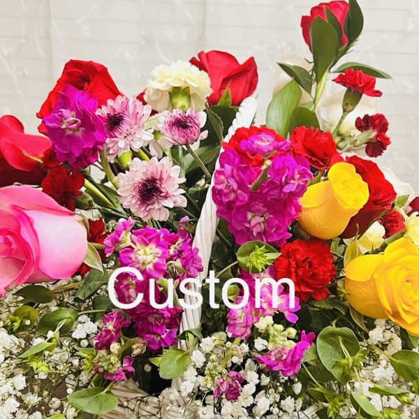 Mixed bouquet of roses, carnations, and daisies with white filler flowers
