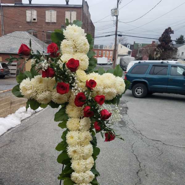 Cross-shaped floral standing spray with white mums and red roses
