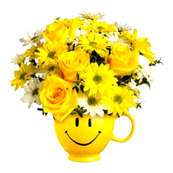 Yellow roses and daisies arranged in a smiley-face mug