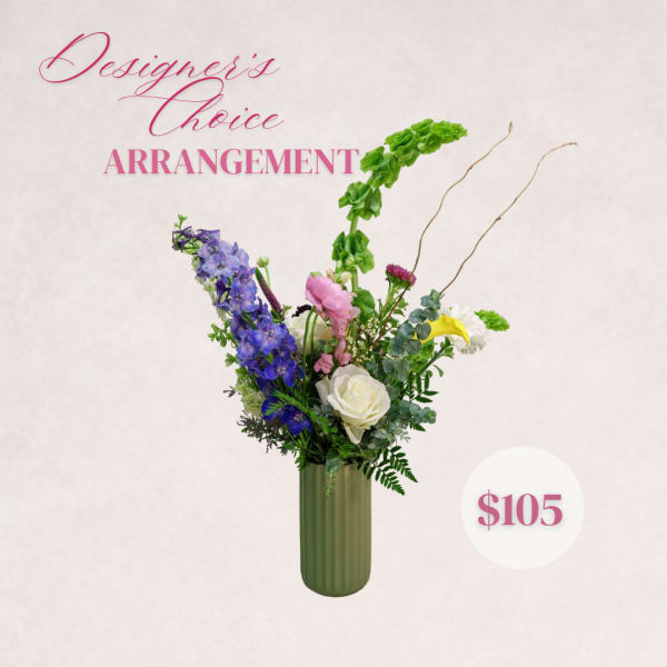 Tall mixed flower arrangement in a green vase with pink text and a price badge