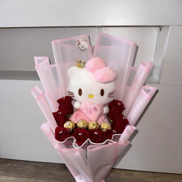 Bouquet of red roses with a Hello Kitty plush and gold chocolates in pink wrap