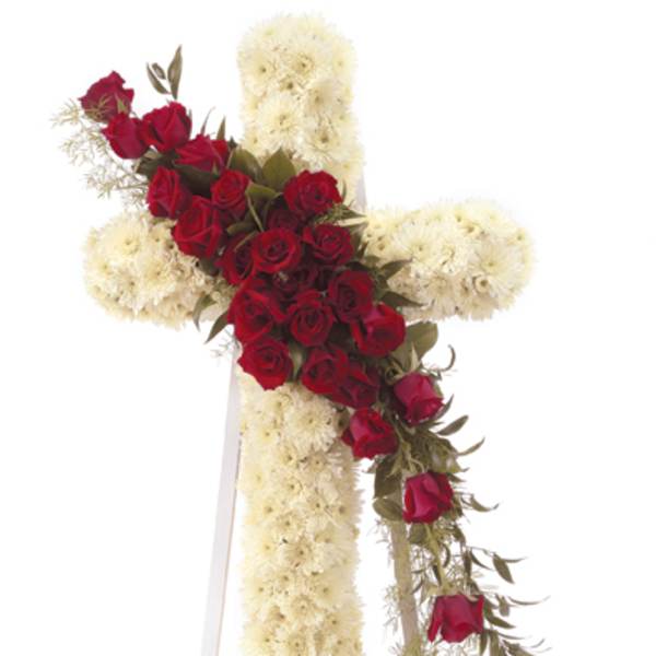 Red roses arranged in a cross with white flowers