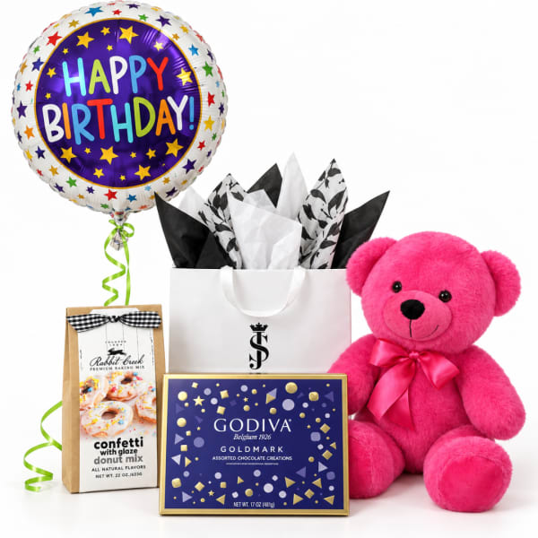 Birthday balloon with a pink teddy bear, chocolates, and baking mix gift set