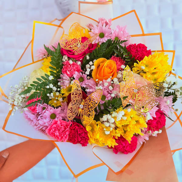 Bright mixed bouquet with pink, yellow, and orange flowers