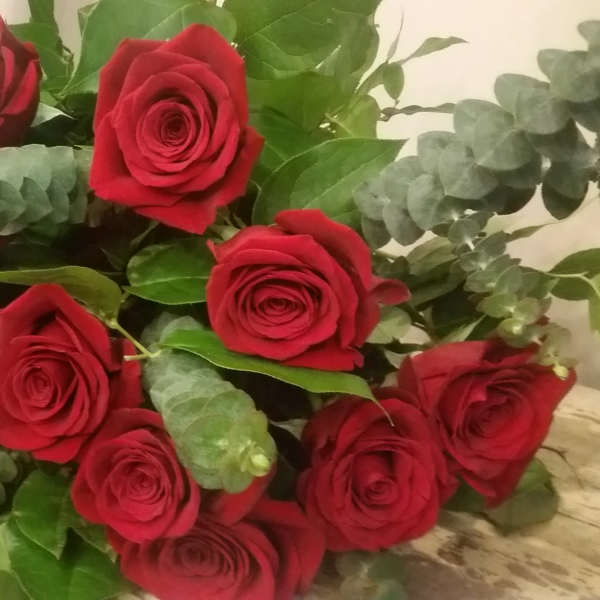 Bouquet of red roses with eucalyptus greenery