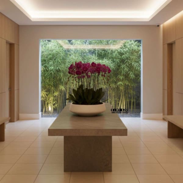 Purple orchids in a white bowl on a table in a modern room