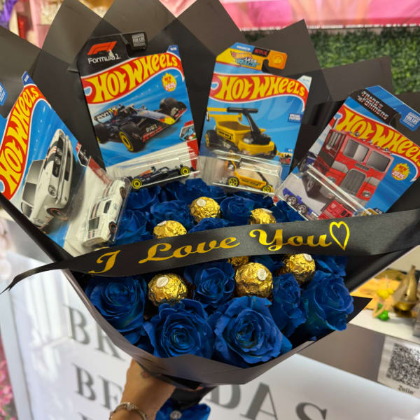 Blue rose bouquet with Hot Wheels toy cars and gold chocolates