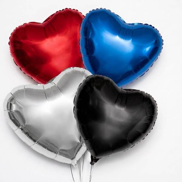 Four heart-shaped balloons in red, blue, silver, and black
