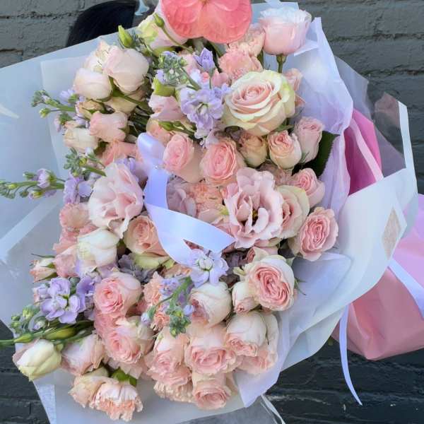 Large pastel bouquet with pink roses and a pink anthurium bloom