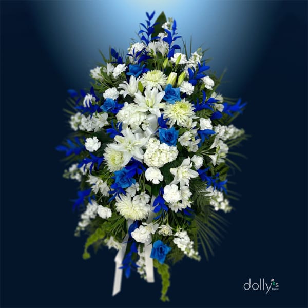 Blue and white floral standing spray with ribbon tails