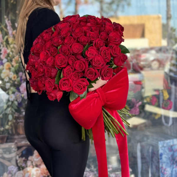 Large bouquet of red roses tied with a red bow