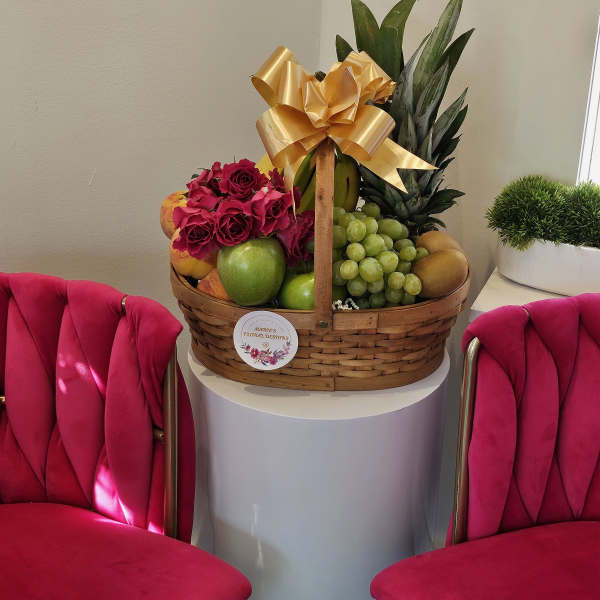 Fruit basket with roses and a gold bow
