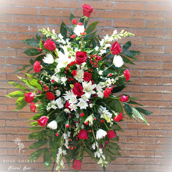 Large standing floral spray with red roses and white flowers