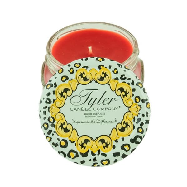 Red candle in a glass jar with a patterned lid