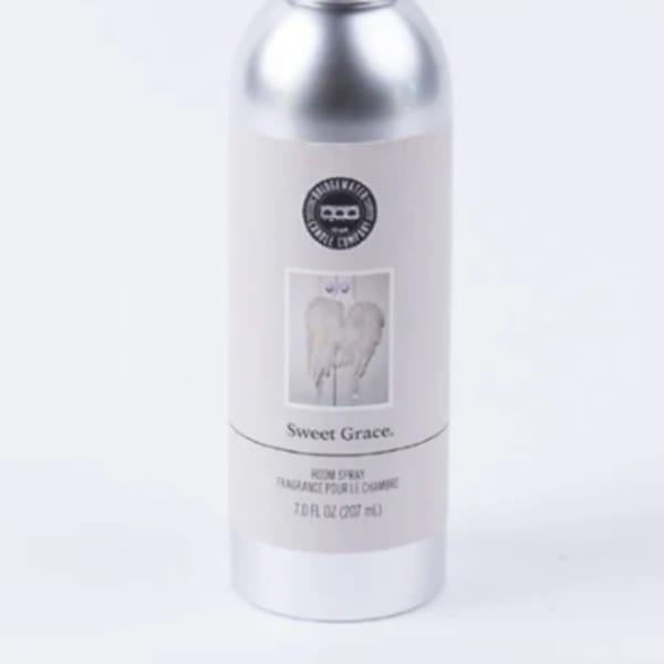 Silver room spray bottle with black cap and label