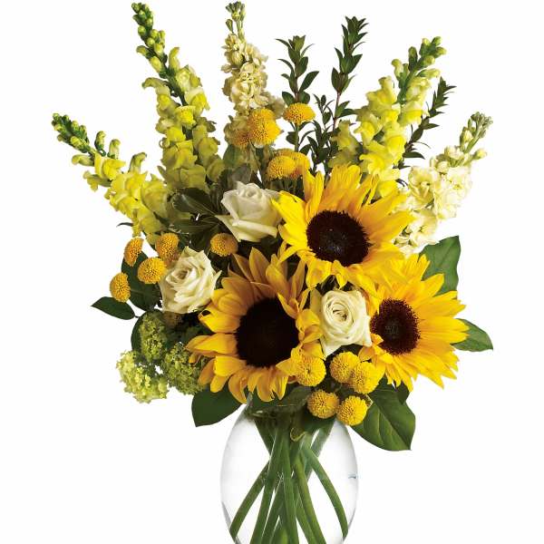 Sunflowers and white roses in a clear glass vase