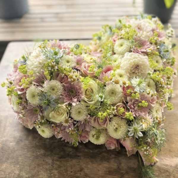 Pastel bouquet with roses, chrysanthemums, and small daisies