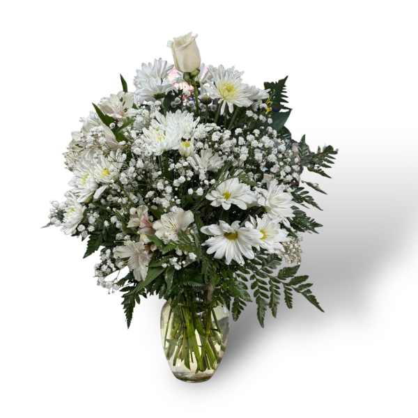White floral bouquet in a clear glass vase