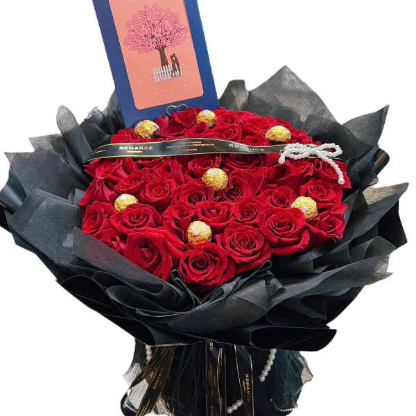 Bouquet of red roses with chocolates and a greeting card