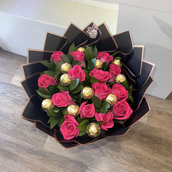 large arrangement with fuchsia roses, chocolate-encapsulated Ferrero Rocher