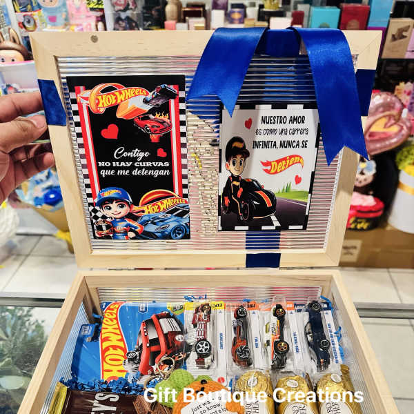 Gift box with Hot Wheels cards, chocolates, and blue ribbon