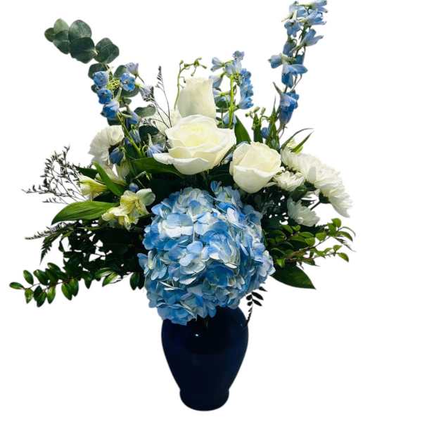 Blue and white floral arrangement in a dark vase