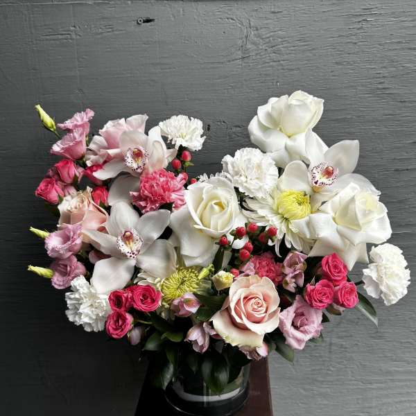 Pink and white mixed bouquet in a glass vase