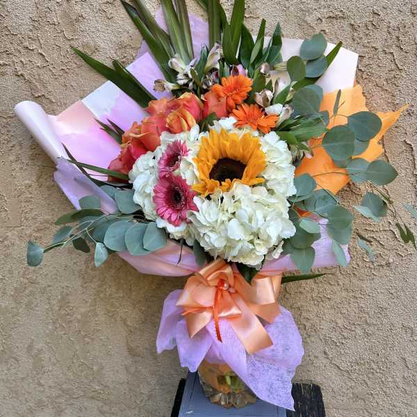 Bouquet with sunflowers, gerbera daisies, roses, and white hydrangeas