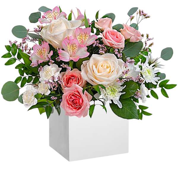 Pink and white roses with alstroemeria in a white box