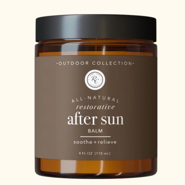 Amber jar of after-sun balm with a black lid and brown label