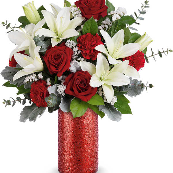 Red roses and white lilies in a red vase