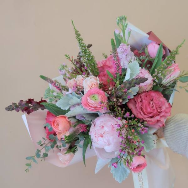 Pink and peach mixed bouquet with roses and ranunculus