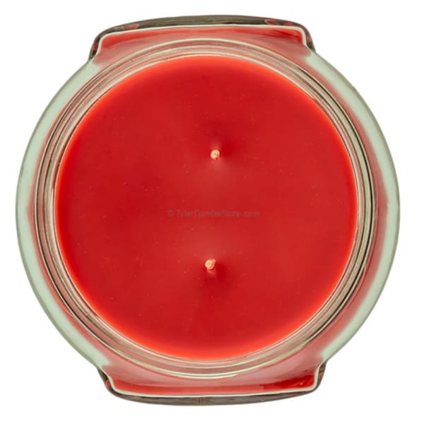 Red candle in a round glass jar