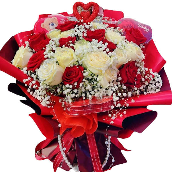 Bouquet of red and white roses with baby’s breath in red wrapping