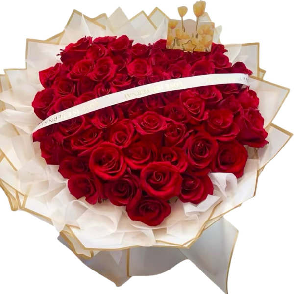 Bouquet of red roses wrapped in white and gold paper