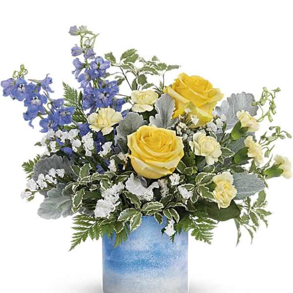 Yellow roses and blue flowers in a blue glass vase