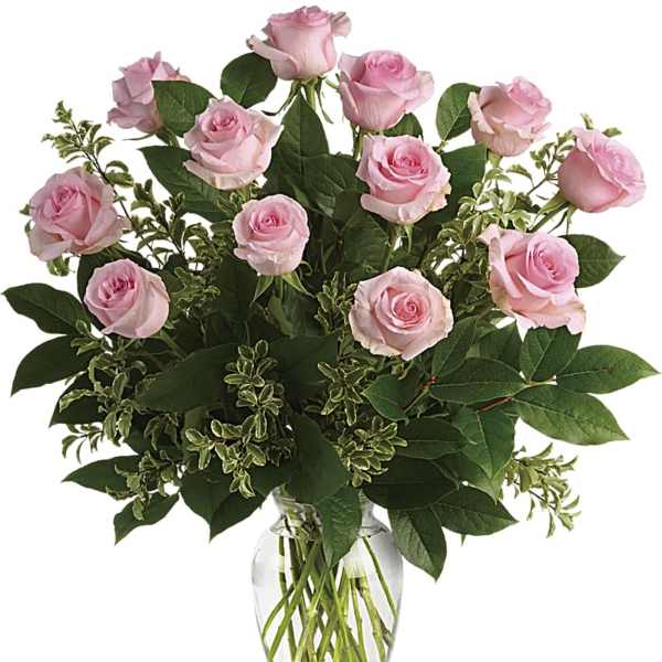 Pink roses arranged in a clear glass vase