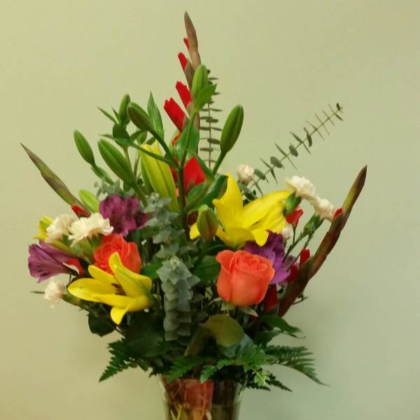 Colorful mixed bouquet in a clear glass vase