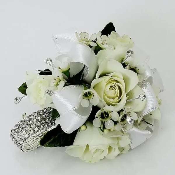 White rose wrist corsage with silver ribbon and rhinestone bracelet