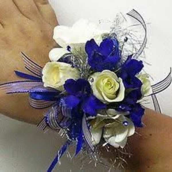 Blue and white wrist corsage with ribbon accents