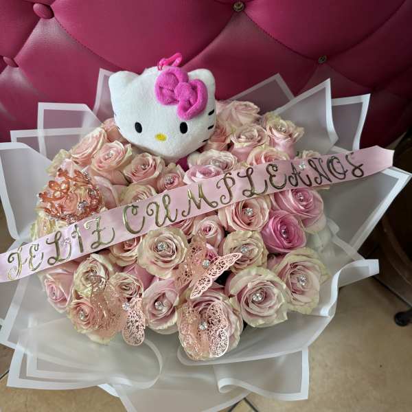Pink rose bouquet with a Hello Kitty plush and a name ribbon