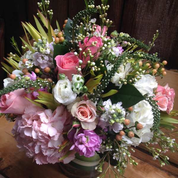 Mixed pink and white flower bouquet in a glass vase