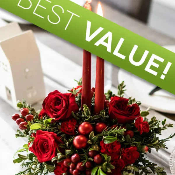 Red rose centerpiece with candles and a green "Best Value!" sign