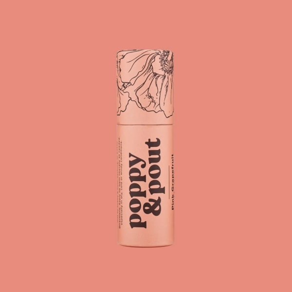 Pink lip balm tube with floral line art on a coral background