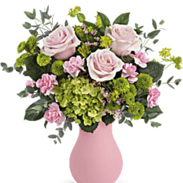 Pink roses and green hydrangeas in a pink vase