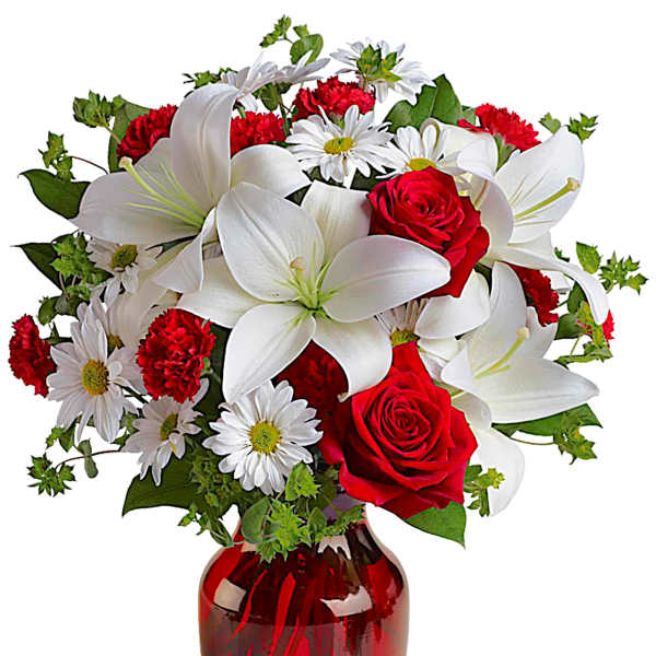Red roses and white lilies in a red glass vase