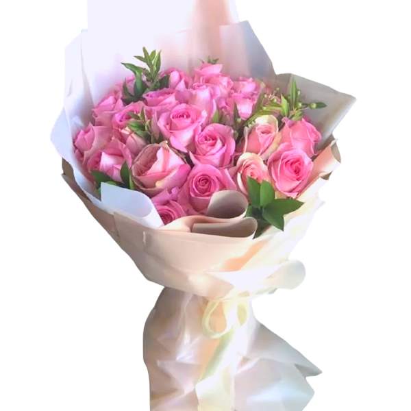 Bouquet of pink roses wrapped in white paper